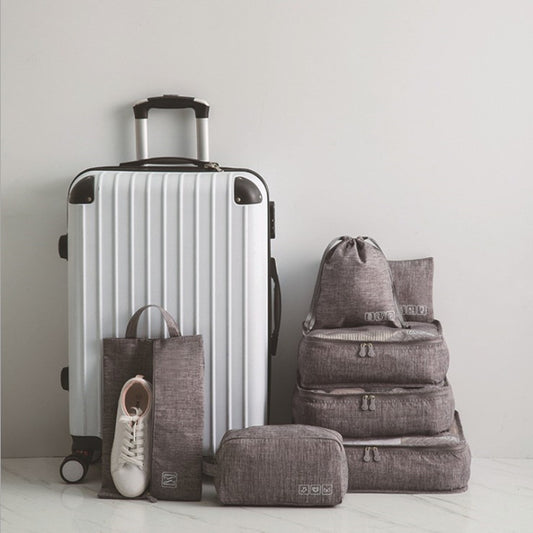 Travel organisers. Grey space saving packing cubes with suitcase