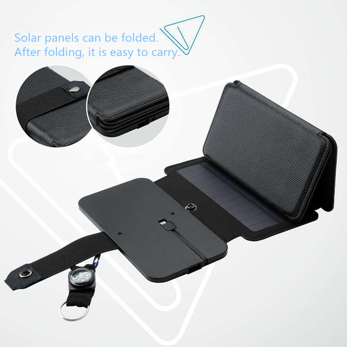Portable solar battery charger in use during wild camping